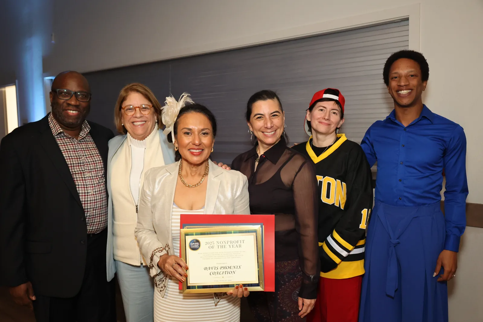 Davis community members honored onstage with a Davis Chamber certificate