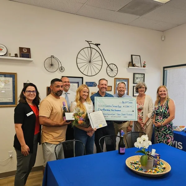 The Davis Chamber Foundation presenting a 2025 Small Business Grant check to Sunshine Sensory Gym