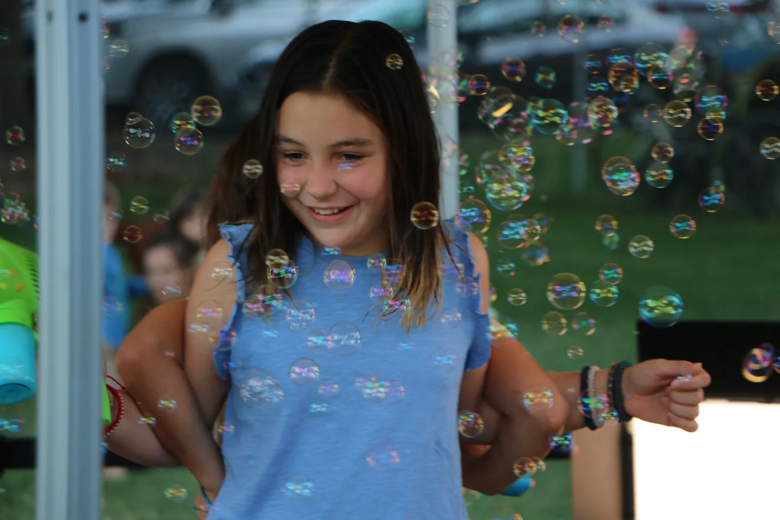 A delighted young Davis student at a community celebration